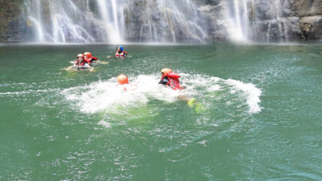 Swim under the falls