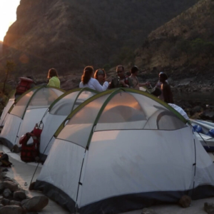 Camping on the riverbank multiday rafting overnight camp